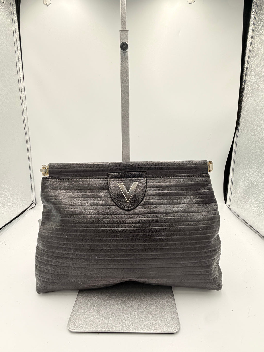 Mario Valentino Black Logo Embossed Clutch | Silver Hardware
