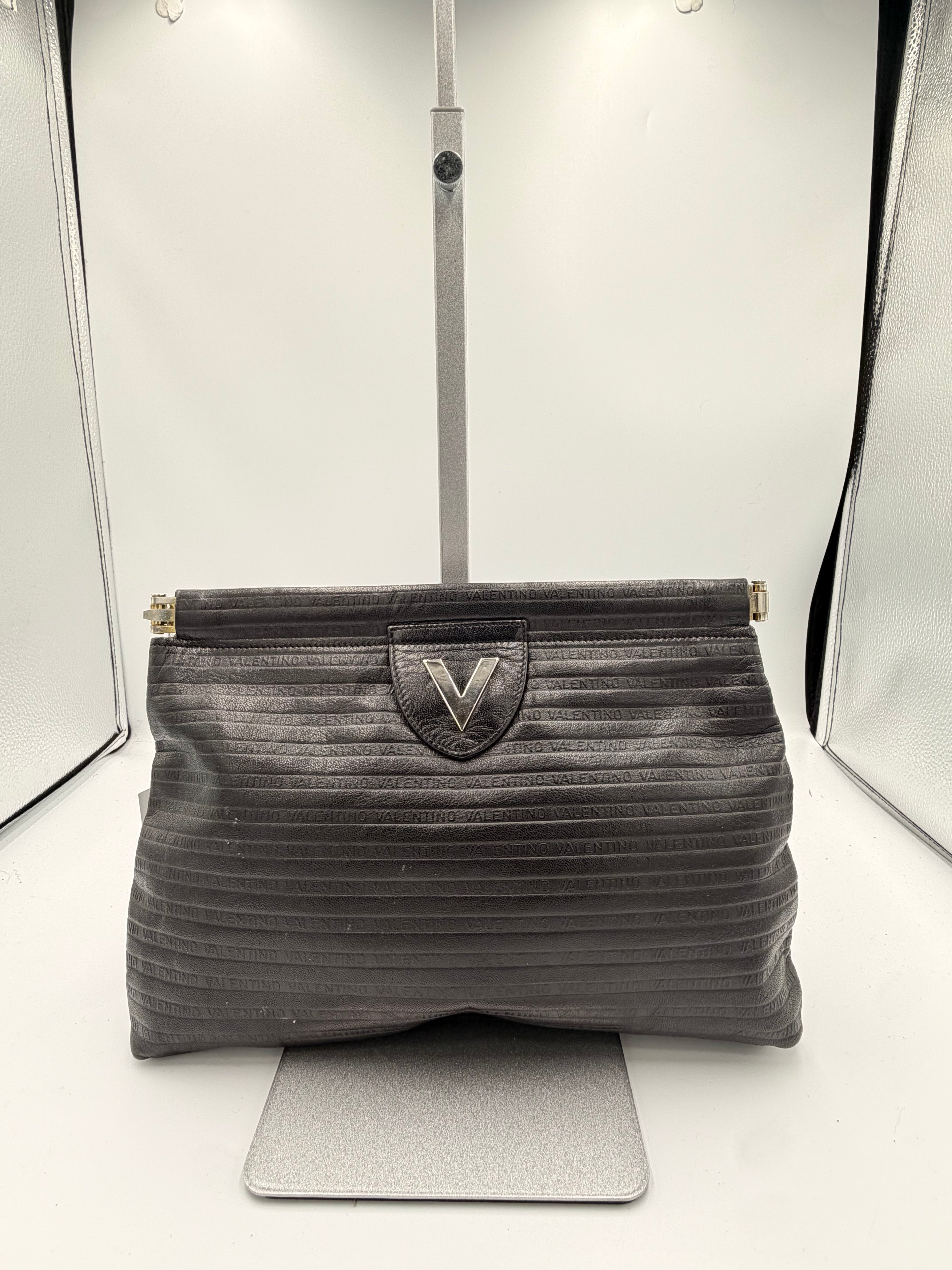 Mario Valentino Black Logo Embossed Clutch | Silver Hardware