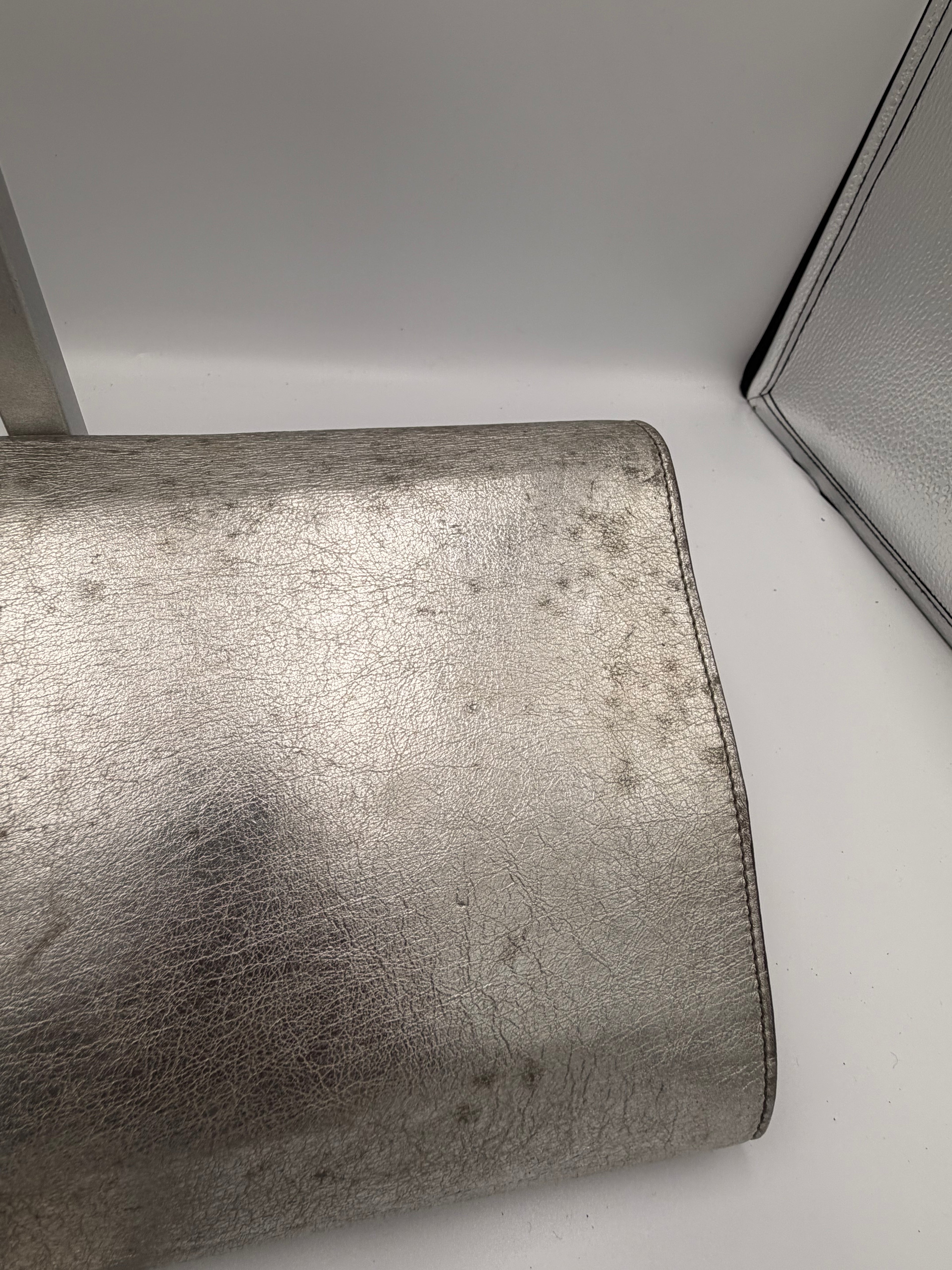 Yves Saint Laurent Metallic YSL Monogram Clutch (Silver/Gold Tone)